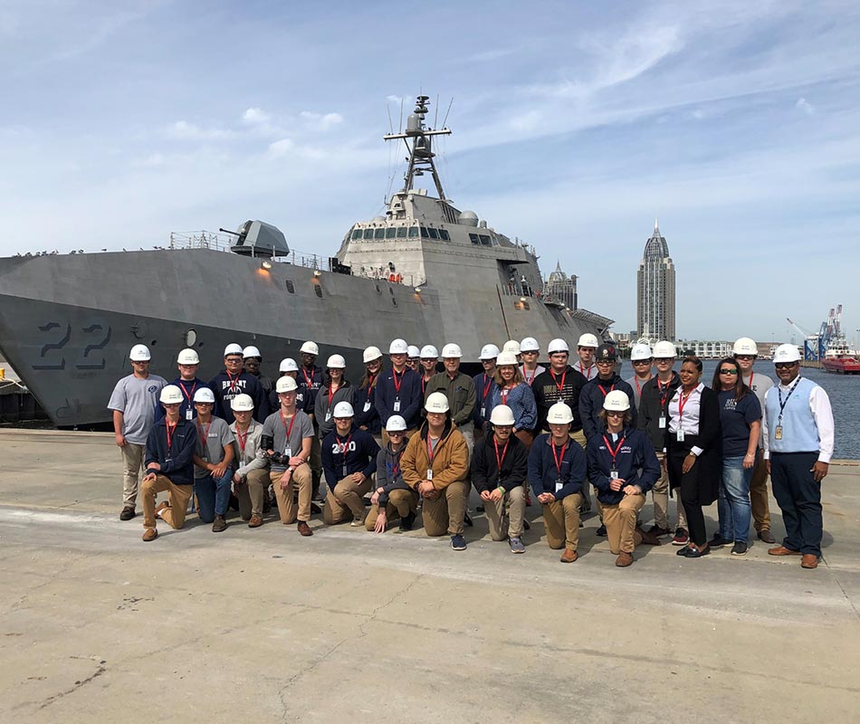 Group of Welders in front of Austal ship