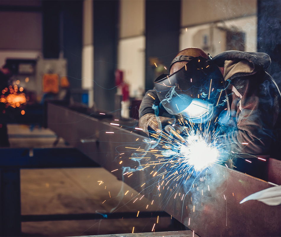 Welder working on I beam